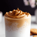Close-up of iced cookie butter latte with cinnamon cold foam