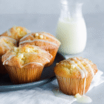 Drizzling white chocolate over lemon muffins